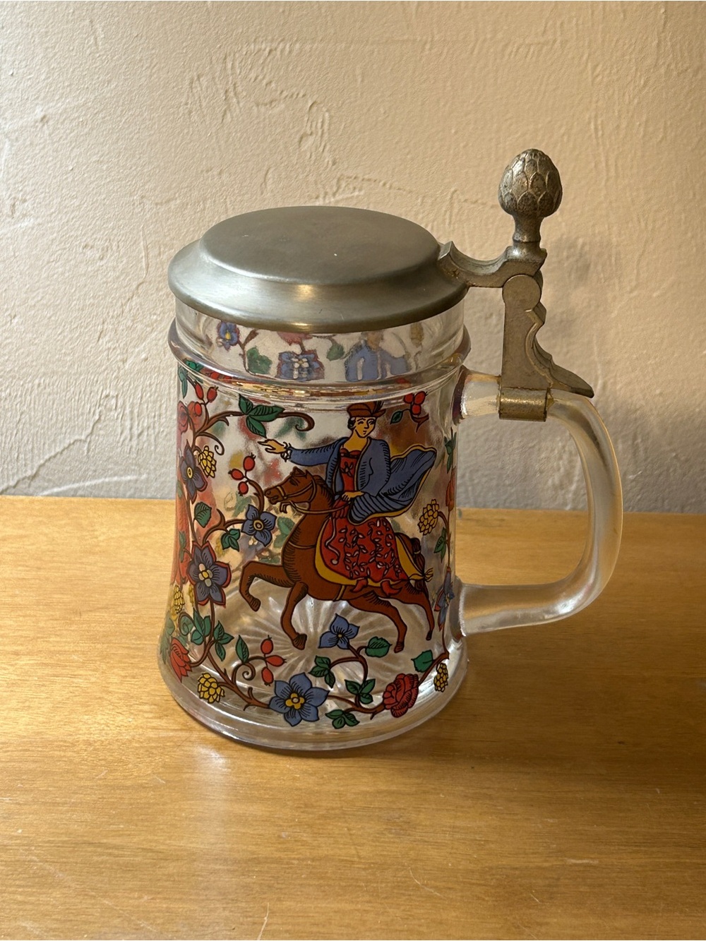 Decorative Glass-Lidded Stein with Horseman and Floral Motif
